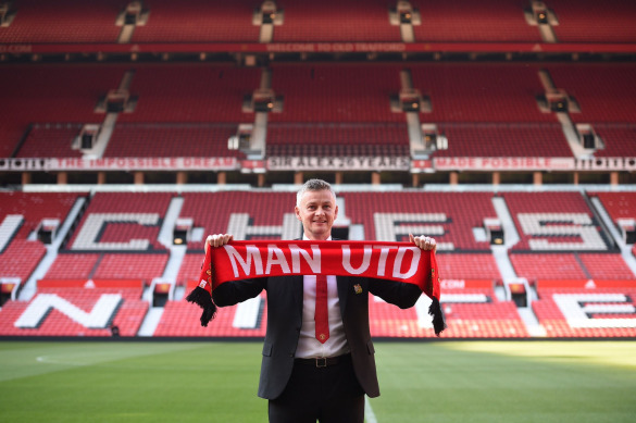 Picture of Ole Gunnar Solskjaer holding scarf at Old Trafford