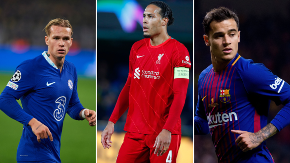 Three soccer players in action. Left: Chelsea player in blue kit. Center: Liverpool player in red kit. Right: Barcelona player in maroon and blue kit.